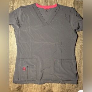 Carhartt scrub top woman’s med medical attire. Lots of pockets, slit for cords
